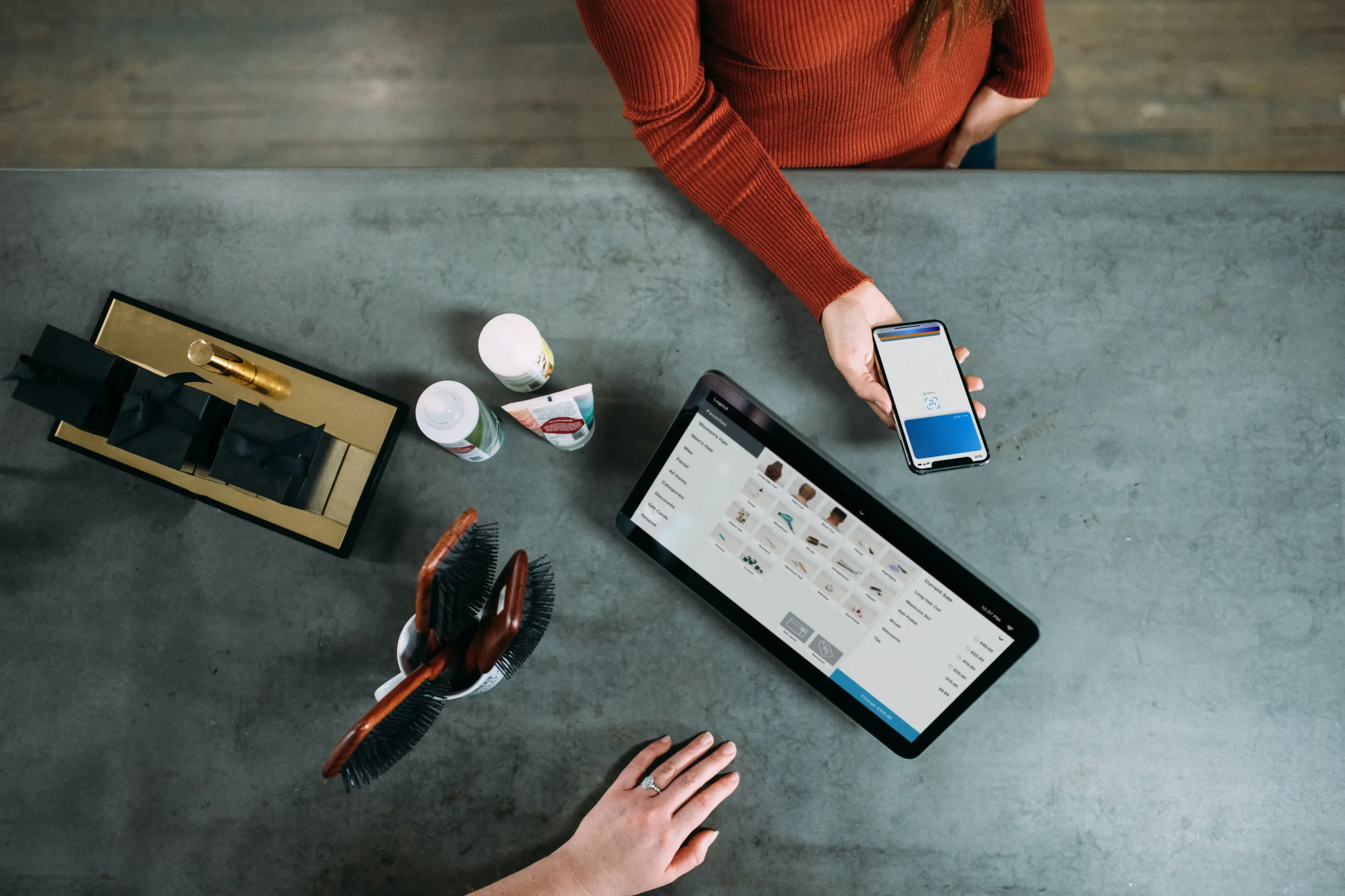 A person is using a tablet and phone